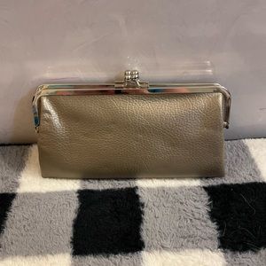 Hobo style wallet.  bronze color. Double clasp sides. Opens wide with storage.